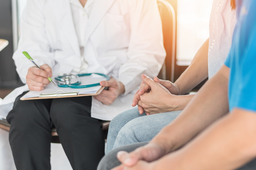 Couple having a discussion with the doctor