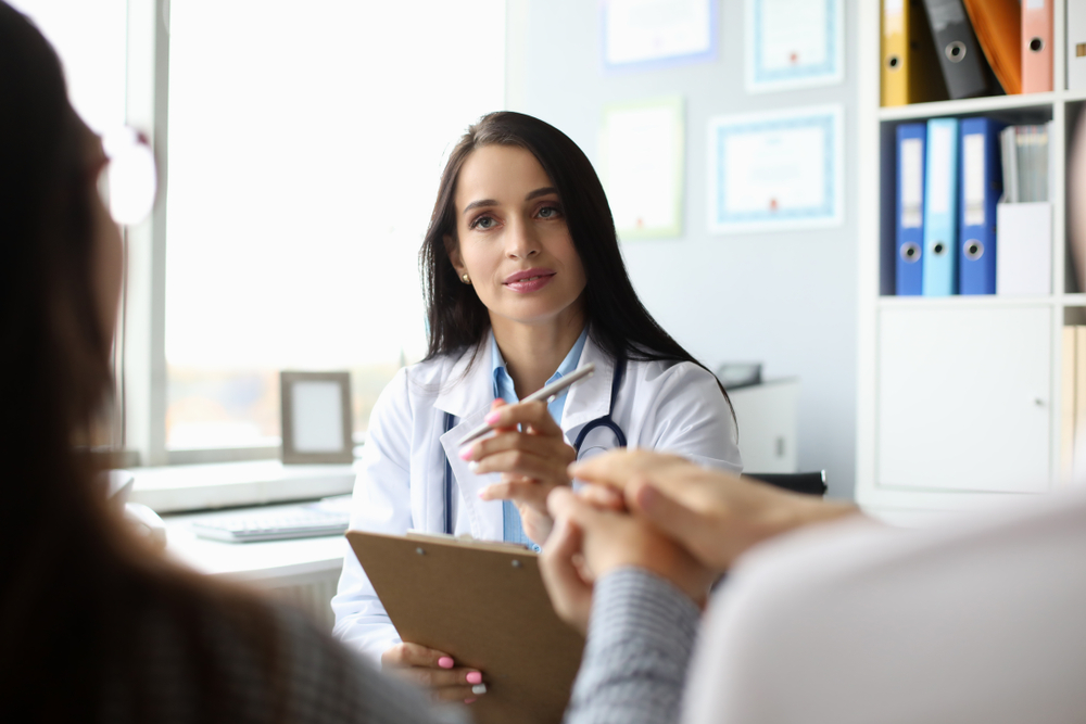 doctor talking to a couple