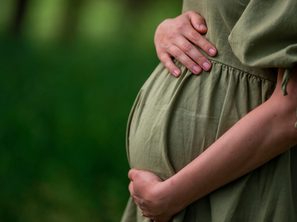 lady holding her baby bump